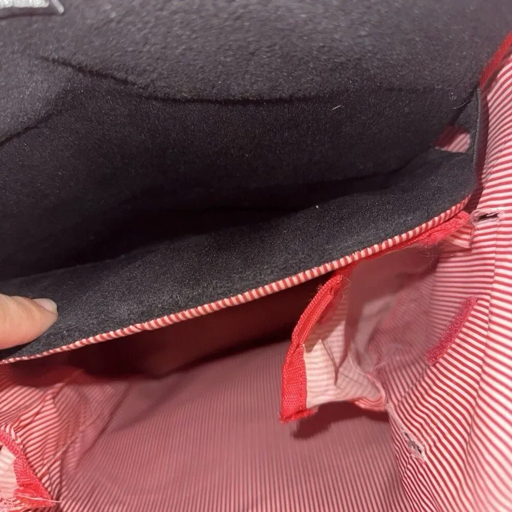 Herschel backpack with pocket. One button is missing, kept it in the front zip.